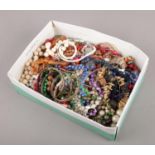 A box of costume jewellery, to include beads, bangles, coin bracelet etc.