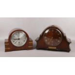 Two walnut cased 8 day mantel clocks with Westminster chime. Works stamped Smiths and Anvil.