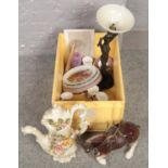 A box of miscellaneous to include large capodemonte ewer, figural table lamp, cabinet plates,