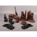 A collection of mainly wooden decorative wares, book ends, Elephant, dish examples