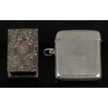 A George V silver vesta case with engine turned engraving, assayed Birmingham 1919. Along with a