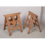 A pair of oak Gothic revival coffin trestles of pegged construction and
