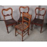 Three Victorian mahogany carved dining chairs along with another carved mahogany chair with