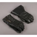 Two pairs of vintage leather motorcycle gloves.