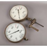 Two brass pressure gauges, both by Hopkinson, Huddersfield. (Diameter 26cm).