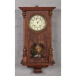 A walnut cased 8 day Vienna wall clock. Housing a Lenzkirch two train movement striking on two