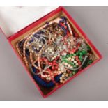 A box of costume jewellery beads.