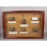 A mid 20th century shadow box display of nautical interest. With six examples of rope slings used
