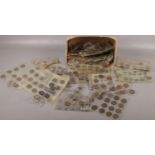 A large quantity of assorted coins in collectors wallets. Mostly British pre decimal.