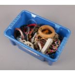 A box of costume jewellery, to include white metal pendant, beads, bangles etc.