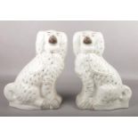 A pair of Victorian Staffordshire mantel dogs, formed as King Charles spaniels.