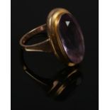 A 9ct gold ring set with large amethyst stone. Size M