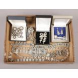 A box of white paste costume jewellery including an Art Deco style brooch etc.