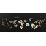 A collection of dress jewellery including silver pieces and enamelled examples. Five pieces formed