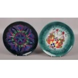 Two Moorcroft cabinet plates; one for Spitalfields Temple Mills, the other decorated in the