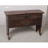 An 18th century oak six plank coffer. Chip carved, with inscribed date