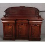 A Victorian carved mahogany chiffonier.