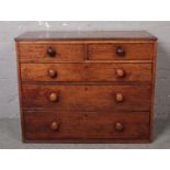 A Georgian oak 2 over 3 chest of drawers. Missing feet.