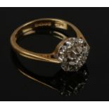 A 18ct gold diamond cluster ring, size M.