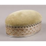 A sterling silver mounted trinket box/ pin cushion.