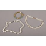 Two strings of pearls, one with 14ct gold clasp, along with a jade coloured hardstone and yellow