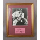 A framed Carl Perkins autographed display.