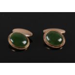 A pair of 9ct gold mounted oval nephrite cufflinks.