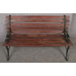 A wood and cast iron garden bench.
