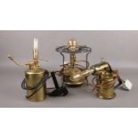 Three decorative electric table lamps, made from a Primus stove, blow lamp and an oil sprayer.