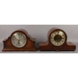 Two oak cased 8 day mantel clocks with Westminster chime. One Garrard and the other signed made in