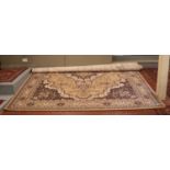 A large faun ground wool carpet with central medallion design. (400cm x 300cm).