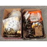 Two boxes of assorted clock spare parts. Including bezels, dials, springs, movements etc.