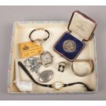 A group of collectables, to include silver West Yorkshire Regiment boxing medal, silver manual