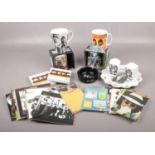 A group of The Beatles collectables, to include mugs, postcards, salt and pepper etc.