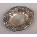 An American sterling silver dish, with floral repousse decoration, by R Wallace & Sons, Connecticut.