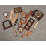 A box of clocks, barometers and thermometers.