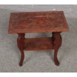 A wooden carved oriental style side table ( approximately 52 cm x 30 cm)