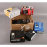 A box of mobile phones, cases and chargers, including Blackberry, Nokia etc.