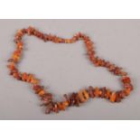 A string of graduated amber beads.