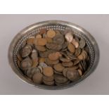 A silver plated bowl containing British pre decimal coins, to include Victorian examples.