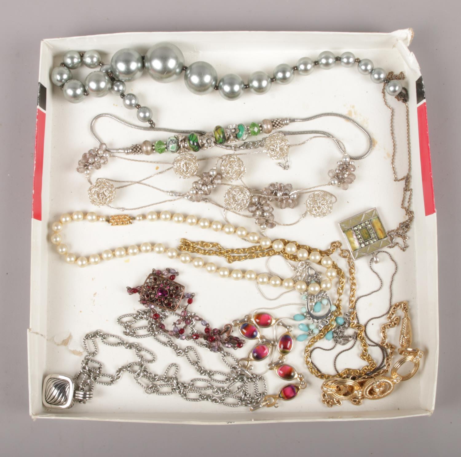 A tray of costume jewellery, to include pendants on chains, necklaces etc.