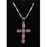 A silver and opal triplet cross pendant on silver twist chain.