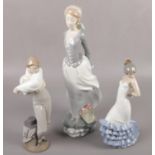 A large Lladro figure of young girl with flower basket (37cm tall) along with two Nao figures.