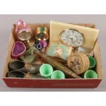 A box of collectables. Including a Swiza malachite effect bedside alarm clock, Elvicta sprit