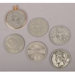 A 1922 silver dollar, 1953 five shilling, 1965 Churchill silver crown, 3x Elizabeth II silver