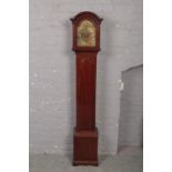 A George V mahogany cased Grandmother clock. With brass arch top and 8 day three train movement