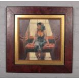 A decorative framed oilograph of a lady.