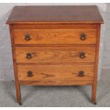 An oak three drawer chest.