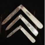 Three silver fruit knives with mother of pearl scales.