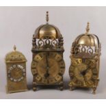 Two 17th century style brass cased lantern clocks and a similar brass cased timepiece with